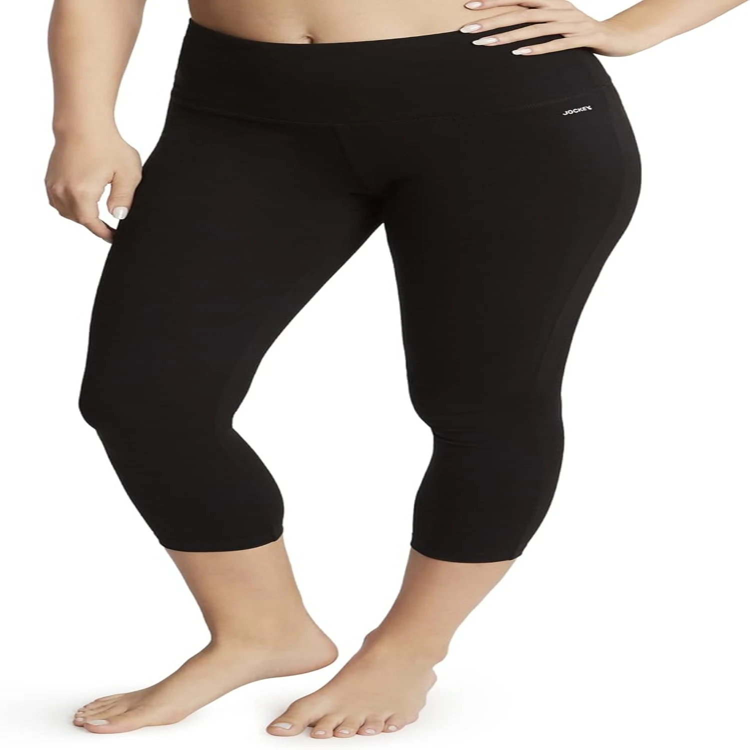 Slimming and chic deep black capri leggings offering a cozy and flexible fit, ideal for medium-sized women seeking the perfect s