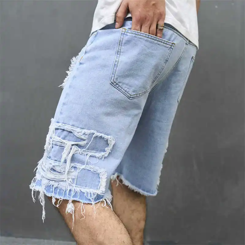 Nieuwe herenjeans met gaten zijn losse trendy herenshorts, casual shorts en cropped broeken voor heren