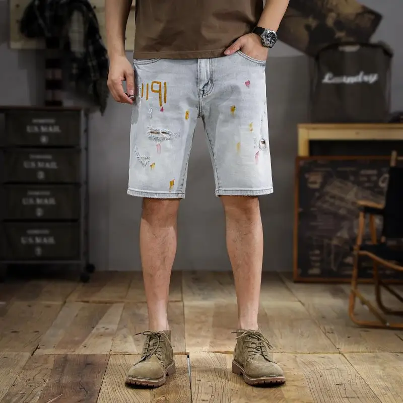 Pantaloncini di jeans di fascia alta bianchi a terra da uomo American tide splash ink pantaloni dritti da cinque minuti tendenza versatili fori rotti