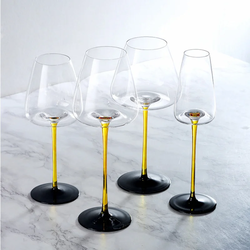 Crystal wine glass with yellow stem and black base