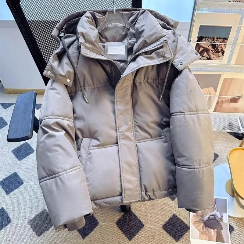 The New Autumn Winter Couple's Cotton-padded Jackets with A Unique Design Sense, Featuring Thick, Loose Bread Coats and Caps.