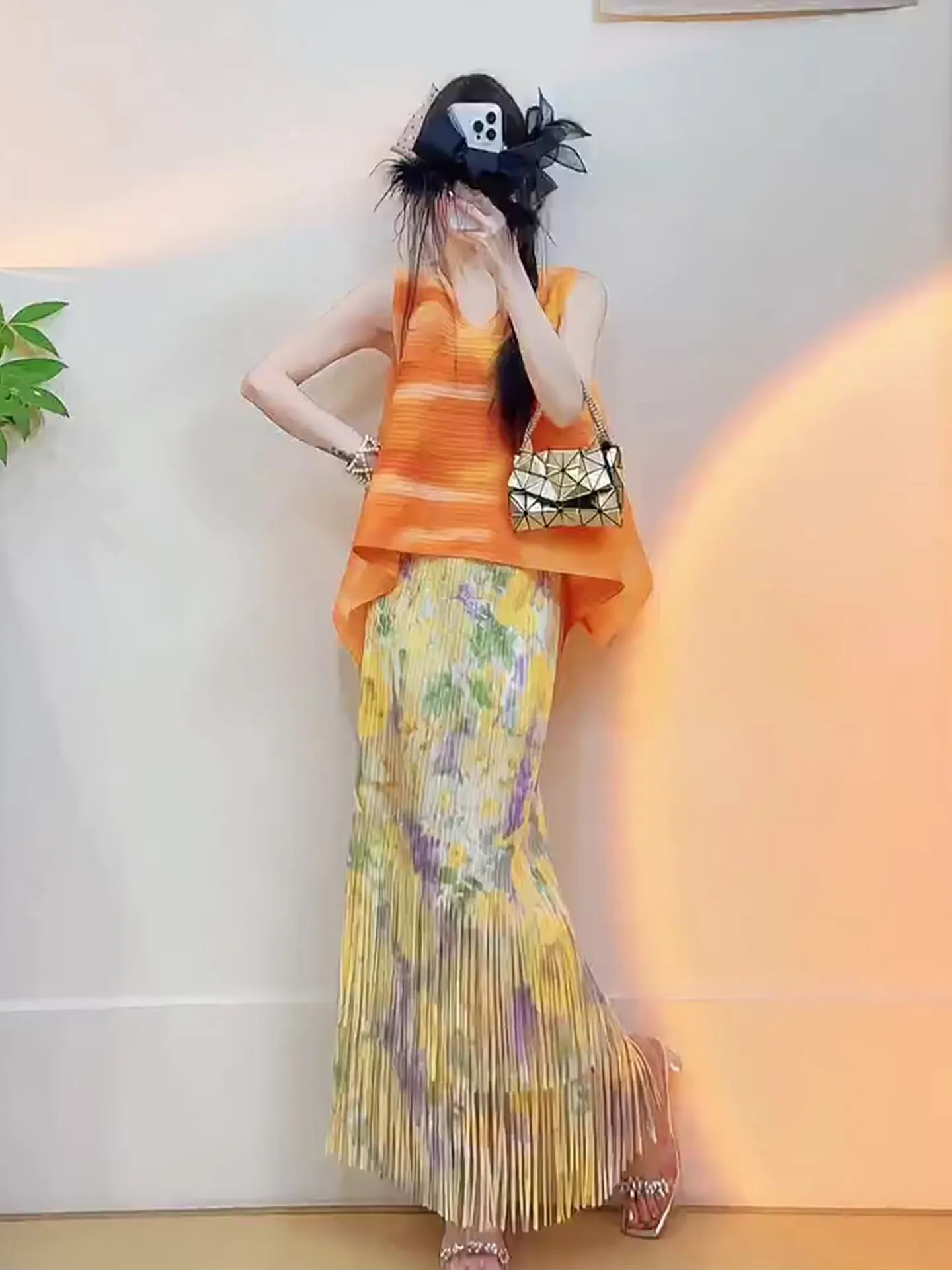 

Orange Sleeveless Summer Outfit with Tassel Skirt And Pleated Top by Sanza Art Creation Fashionable Two-Piece Women's Set