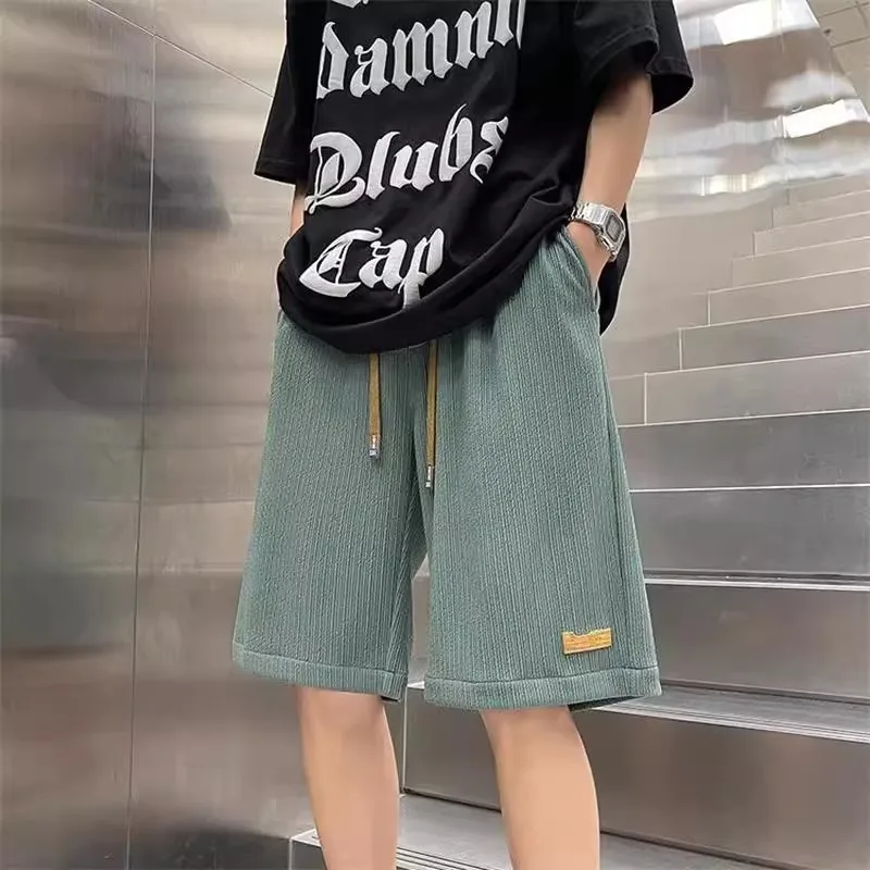 

Летние мужские повседневные брюки из ледяного шелка свободного покроя из тонкого материала длиной пять четвертей для подростков и молодежи...