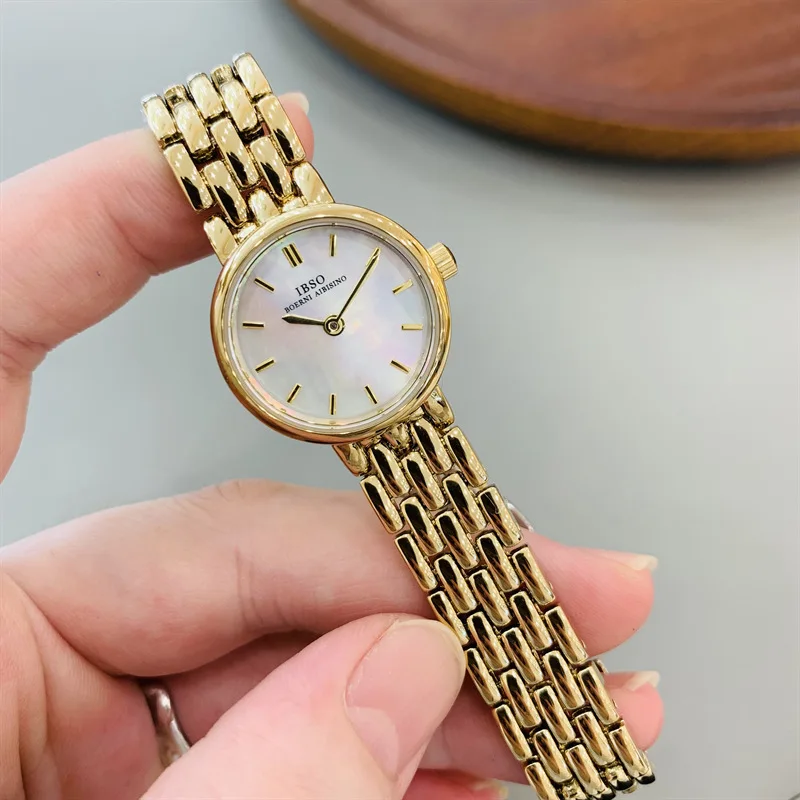 

Elegant women's wristwatch, gold-plated, mother-of-pearl dial, minimalist ultra-thin design, understated luxury.
