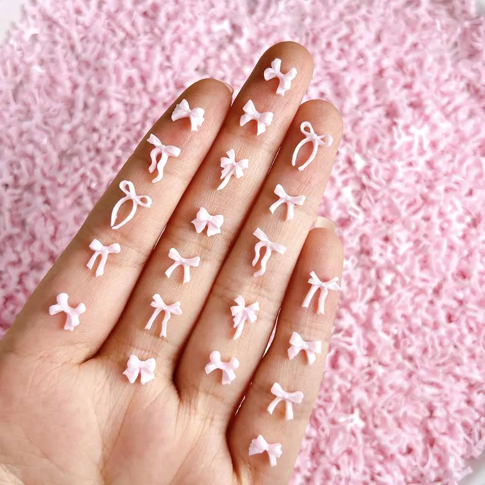 

100Pcs/Bag 3D Mixed Pink Bow Nail Art Charms Resin Hollow Out Kawaii Nail Decorations DIY Mini Bowknot Manicure Accessories &*&
