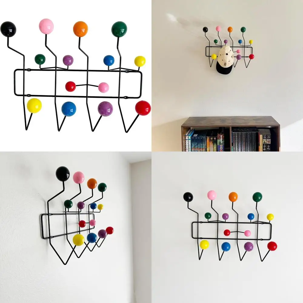 رف معطف مثبت على الحائط على الحائط على شكل فقاعات حديثة في منتصف القرن، إطار أسود على شكل كرة ملونة