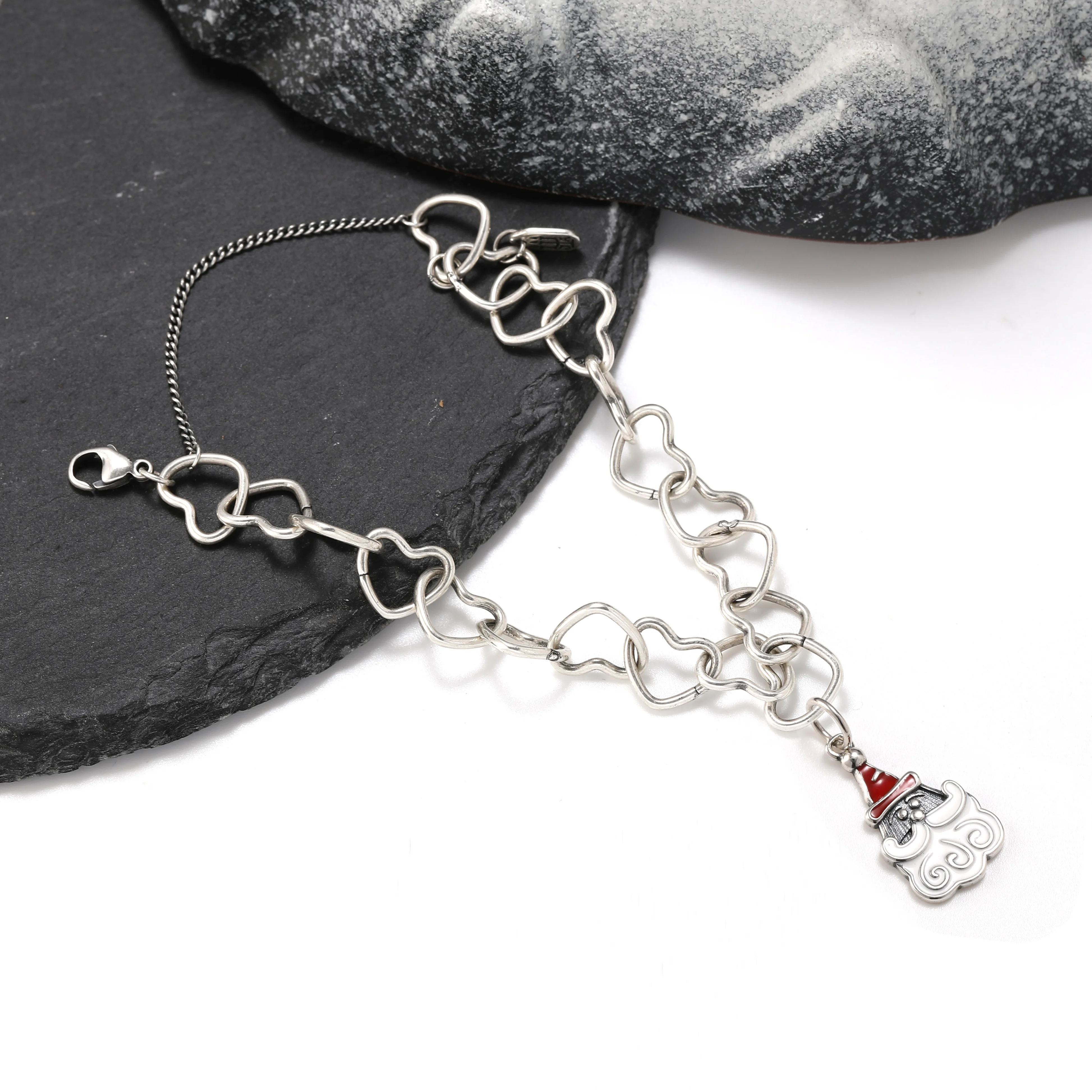 

Genuine 925 sterling silver Connected Hearts Charm Bracelet paired with an Enamel Sweet Santa Claus Pendant