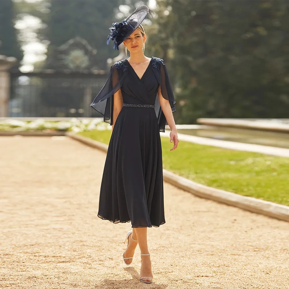 

Navy Blue Mother of The Bride Dress 2026 with Cape V Neck Beading Lace Applique Tea Length Chiffon Wedding Guest Party Gown