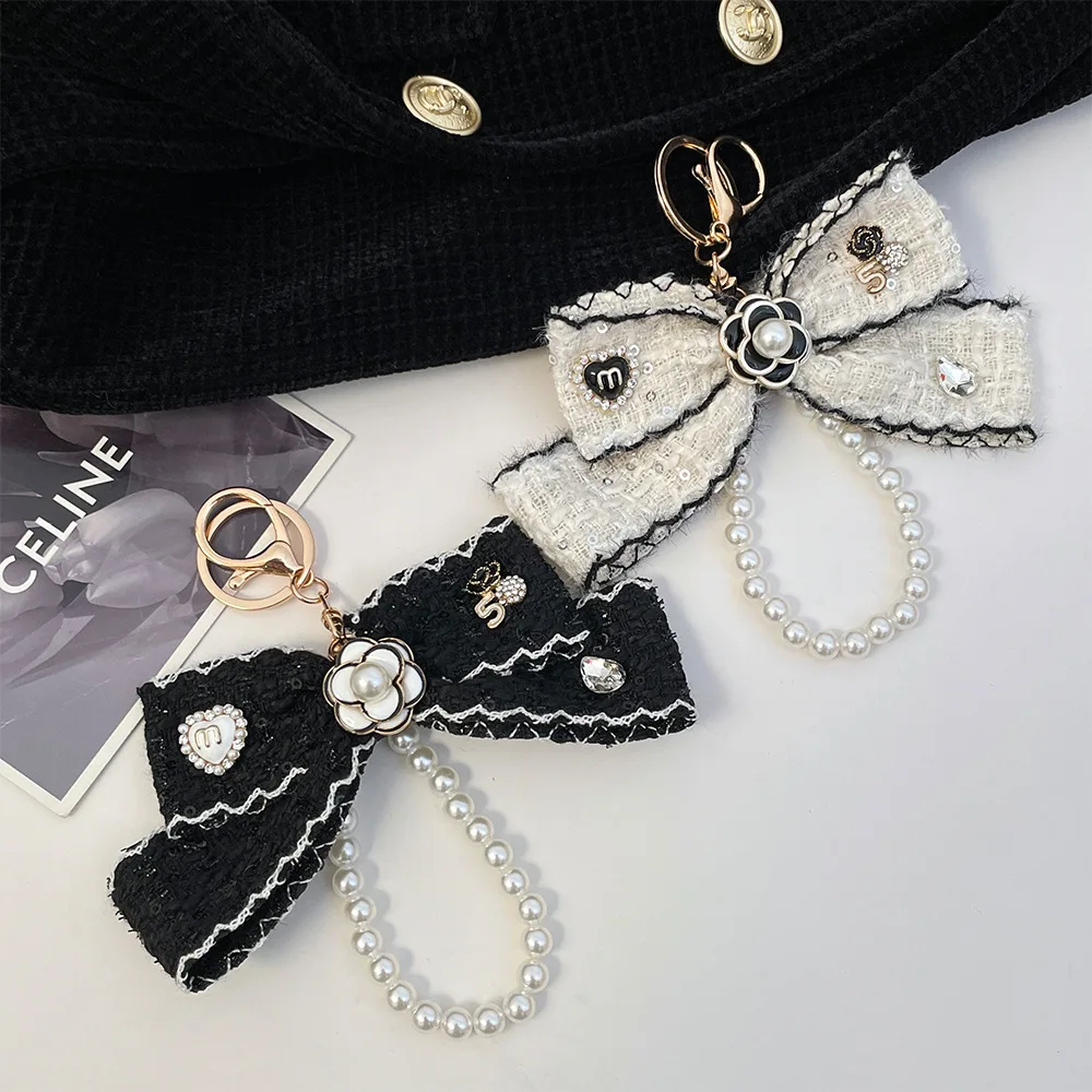 2025 المرأة القماش Bowknot سلاسل المفاتيح حزام Keyrings سيارة مفتاح سلسلة حقيبة العرافة الحلي الإبداعية حلقة رئيسية مجوهرات الأزياء