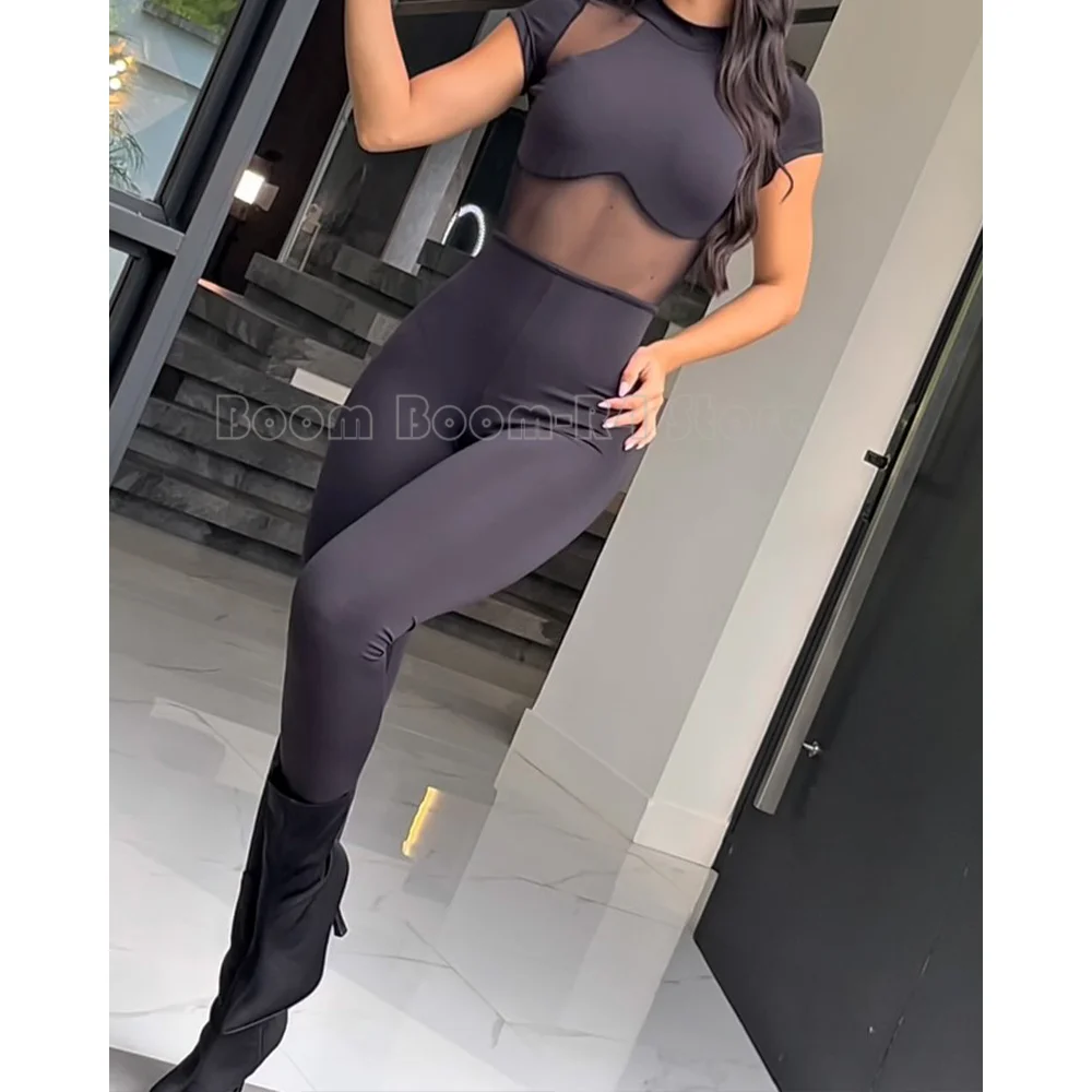 

Black Sheer Mesh Short-Sleeve Jumpsuit with Cutout Back, Mock Neck & Bodycon Legs for Club, Party & Night Out Style