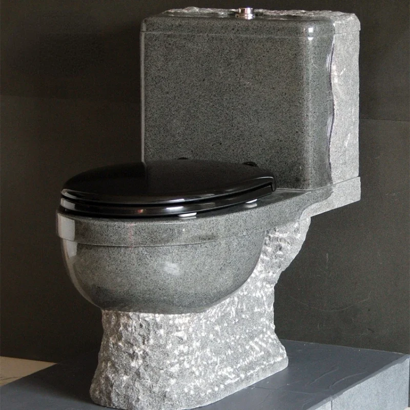 

Standard design granite toilet with plastic seat and lid