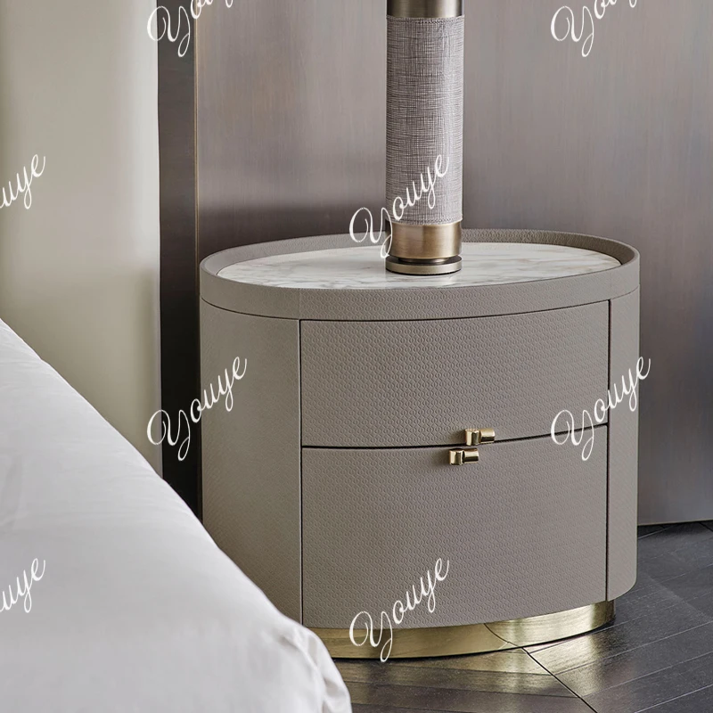 

Italian minimalist marble oval bedside table light luxury designer bedroom bedside table leather storage locker