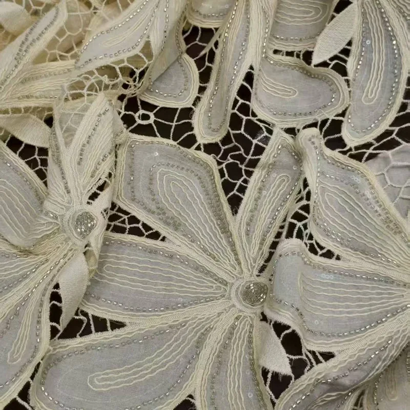 

Luxurious beaded sequined floral hollow water-soluble lace embroidered fabric for use in women's fashion design sold by yard