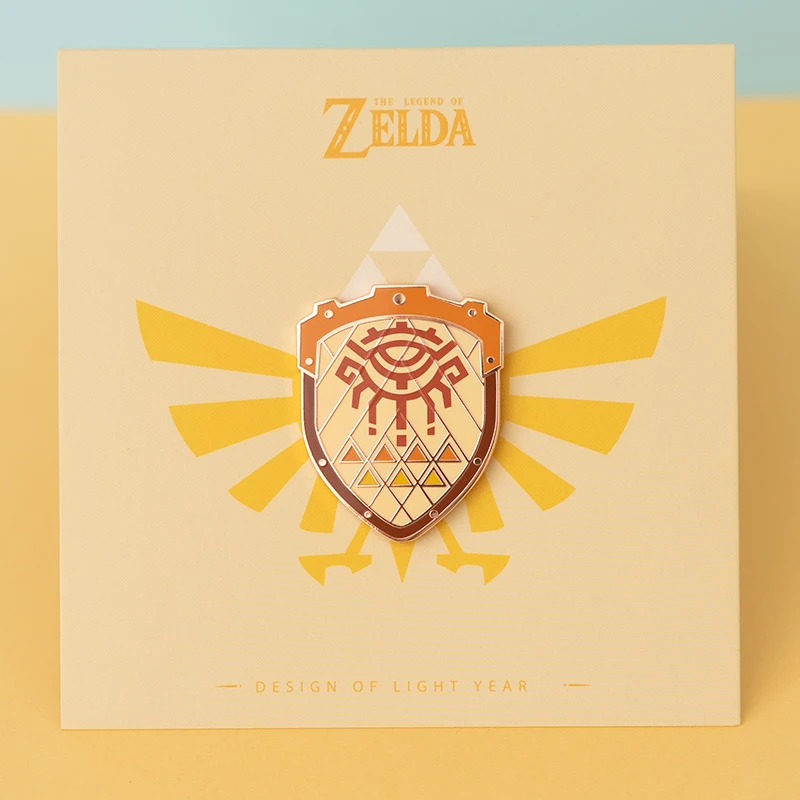 アニメバッジゼルダのハイリアの盾ピンブローチムジュラのマスクマスターソードバッジブローチラペルピンジーンズシャツバッグジュエリーギフト