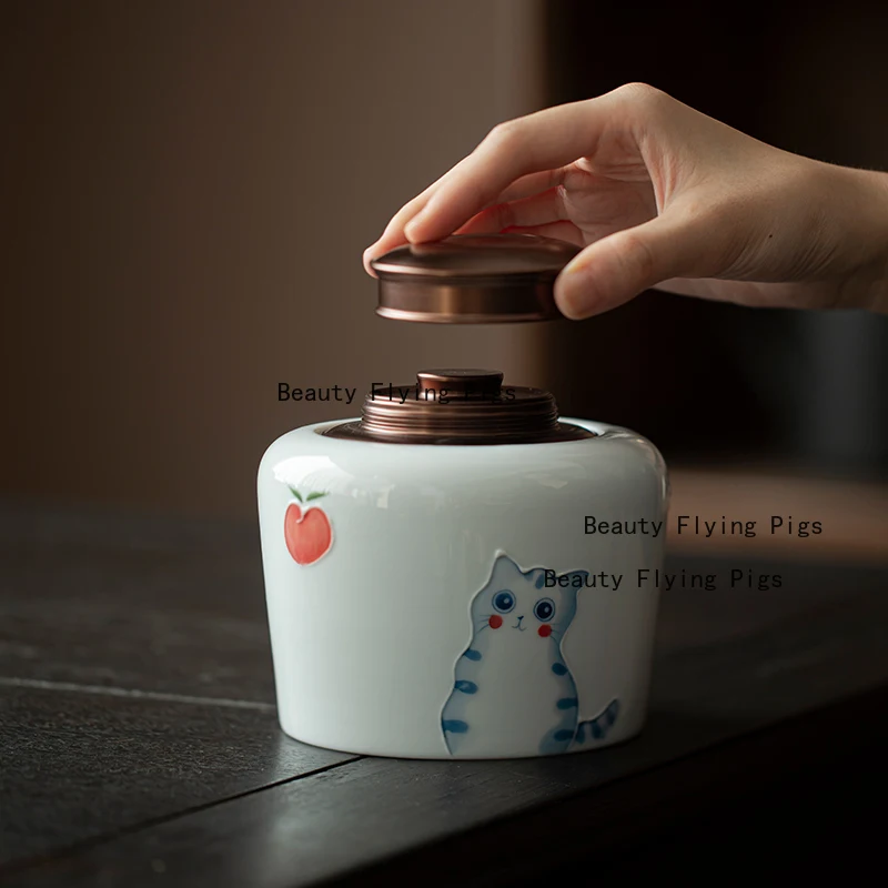 

Small ceramic hand-painted cute cat tea sealed jar metal double lid storage universal storage jar
