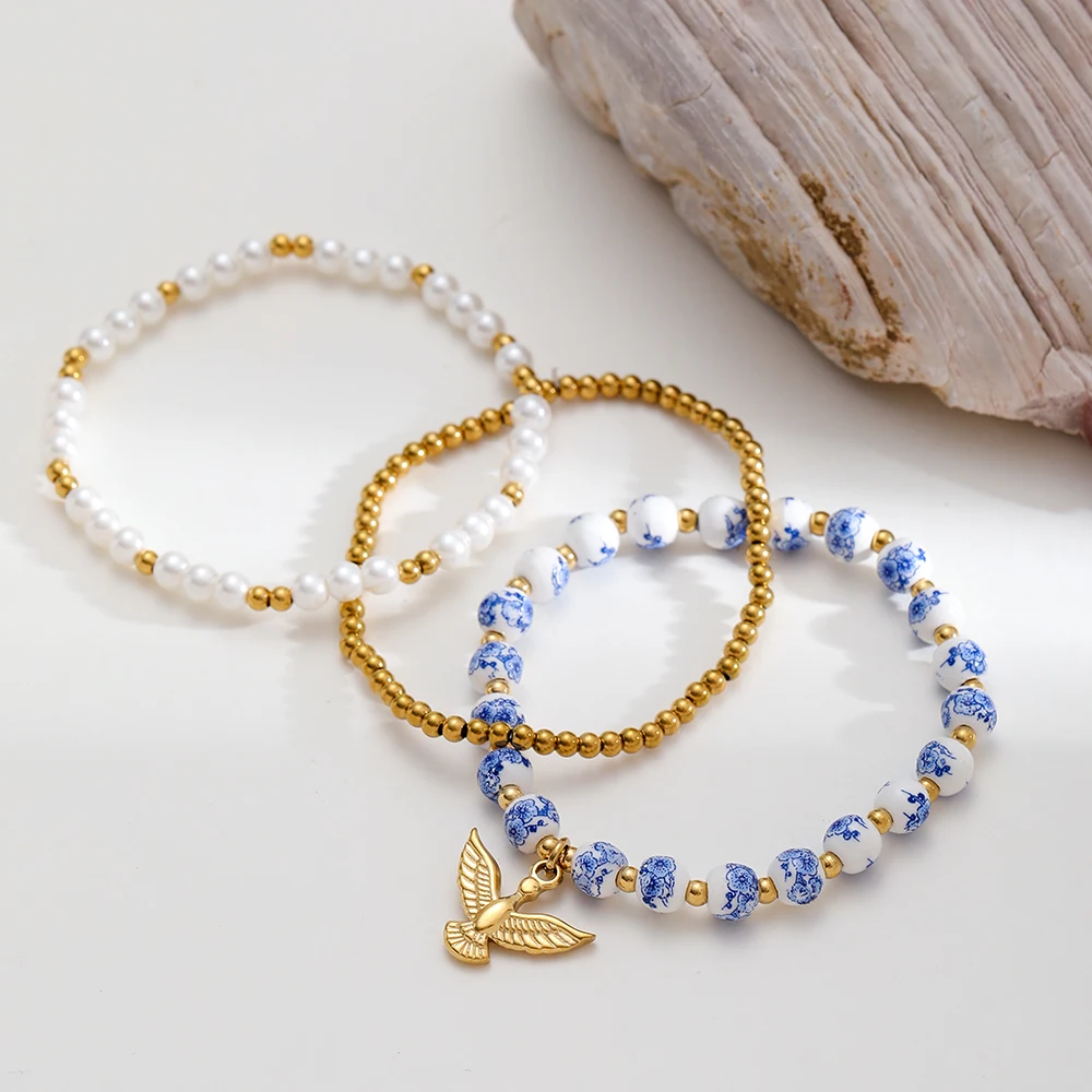 

INS Ceramic Flower Bracelet 18K Gold Plated Eagle Pendant Stainless Steel Faux Pearl Beaded Bracelet Jewelry for Women Gift