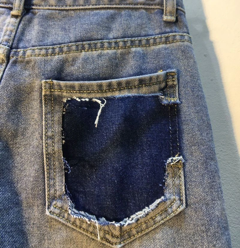 Distintivo nuovo stile industria pesante pantaloncini con perline vita alta stile occidentale pantaloni blu denim dritti strappati dimagranti da donna