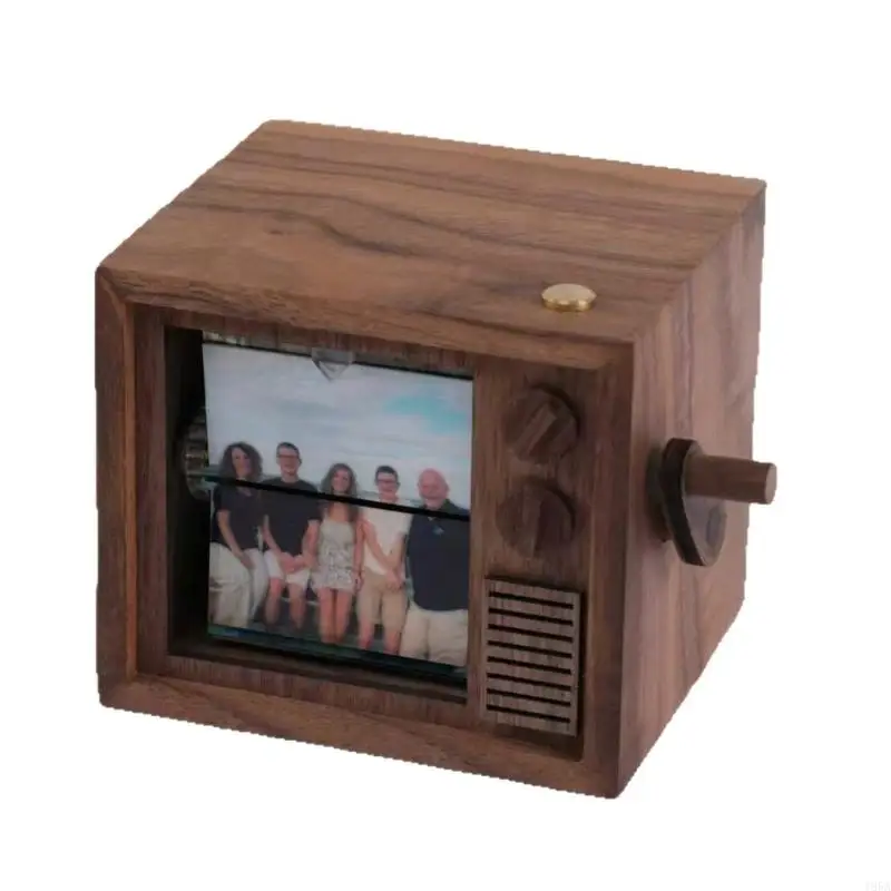 Illuminated, hand-cranked flipss-page photo machine with 16-photo album display stand and music. 