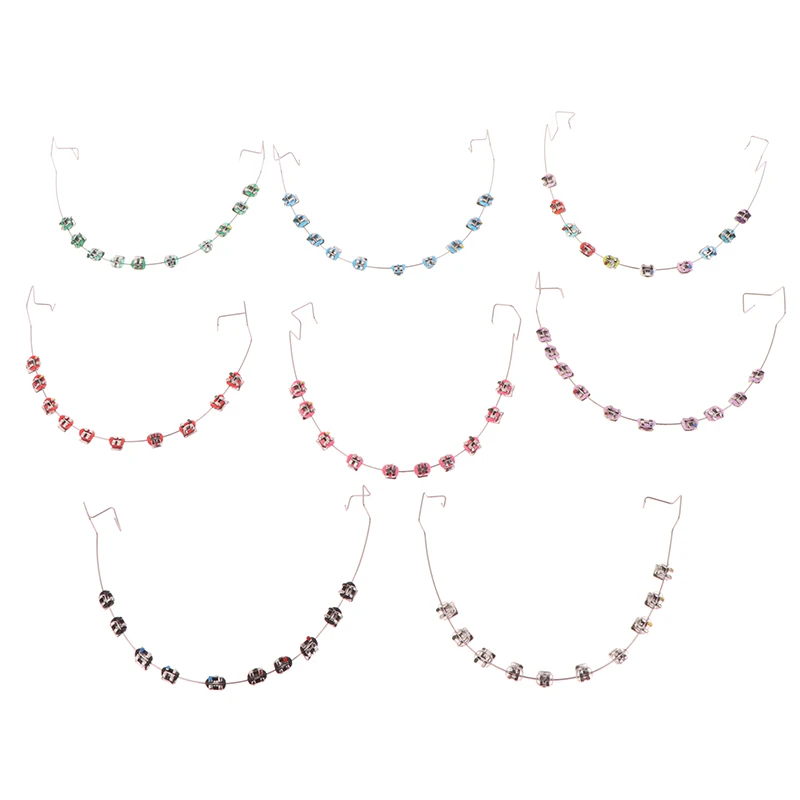 เครื่องประดับฟันชั่วคราวด้วยลวดโลหะ  ตัวยึดโลหะหลากสี และยางรัดจัดฟัน  ของตกแต่งทางทันตกรรม