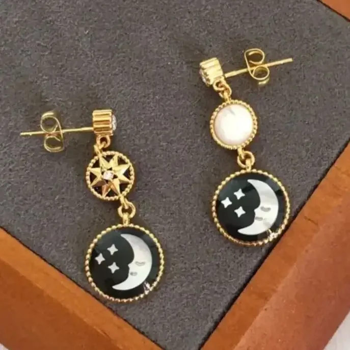 حار أزياء أوروبا القمر الأسود الذهب ستار أقراط المرأة سحر المجوهرات حزب المدرج العصرية