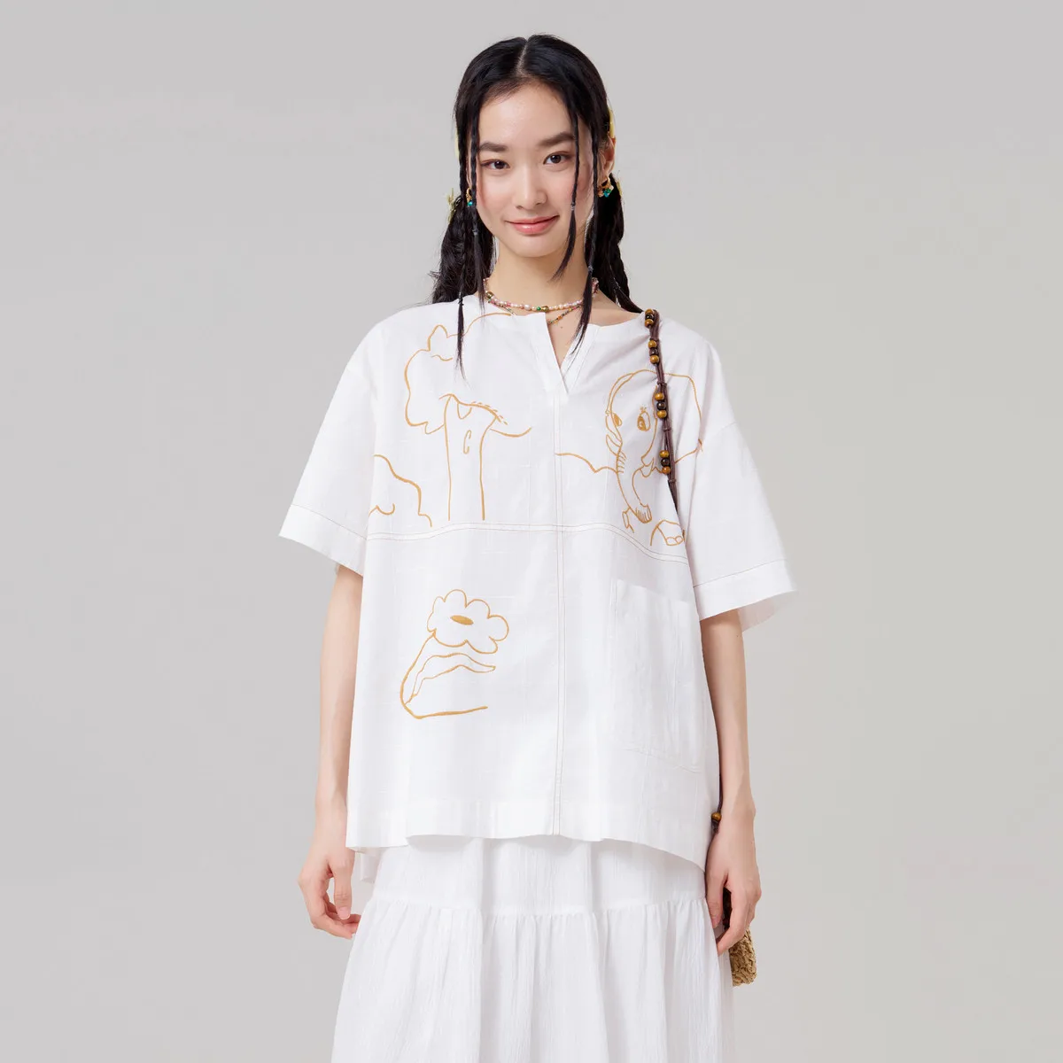 

MOVEUP Short Sleeved V-Neck T-Shirt 2026 Summer New Cartoon Elephant Embroidery Pocket Drop Sleeves Tee Top For Women 3ELX20401