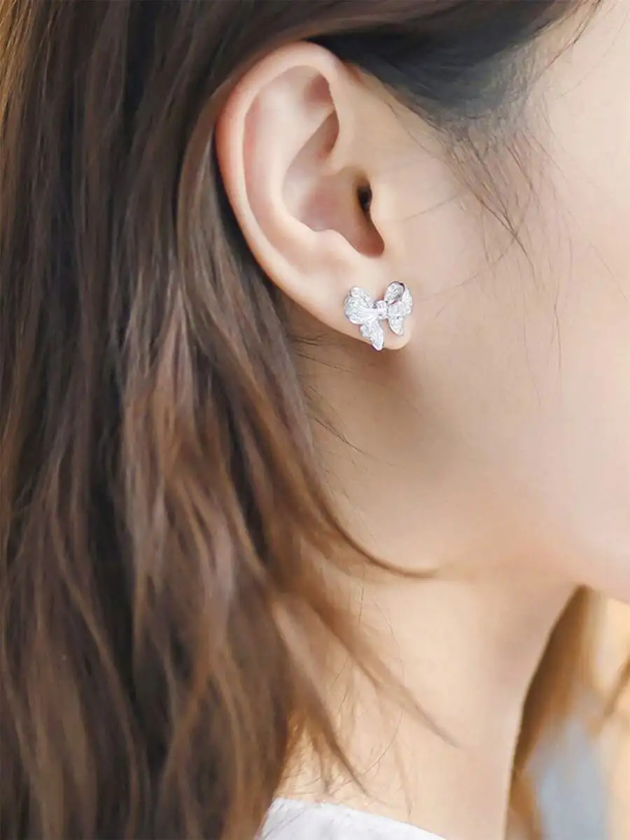 

Copper-Inlaid Cubic Zirconia Bowknot Earrings Pair
