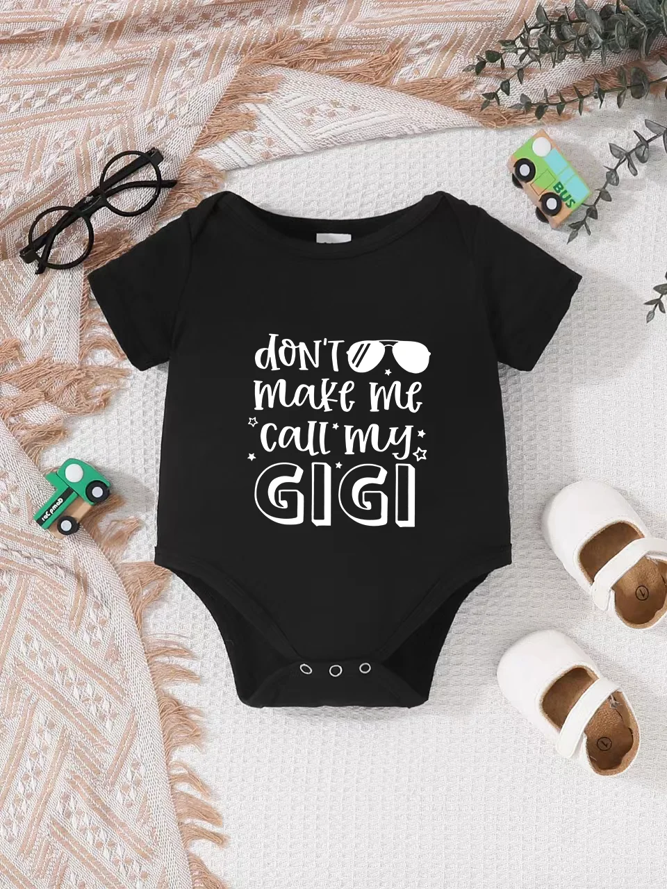 

Playful letter-printed baby short-sleeve triangle bodysuit. Button closure for easy dressing