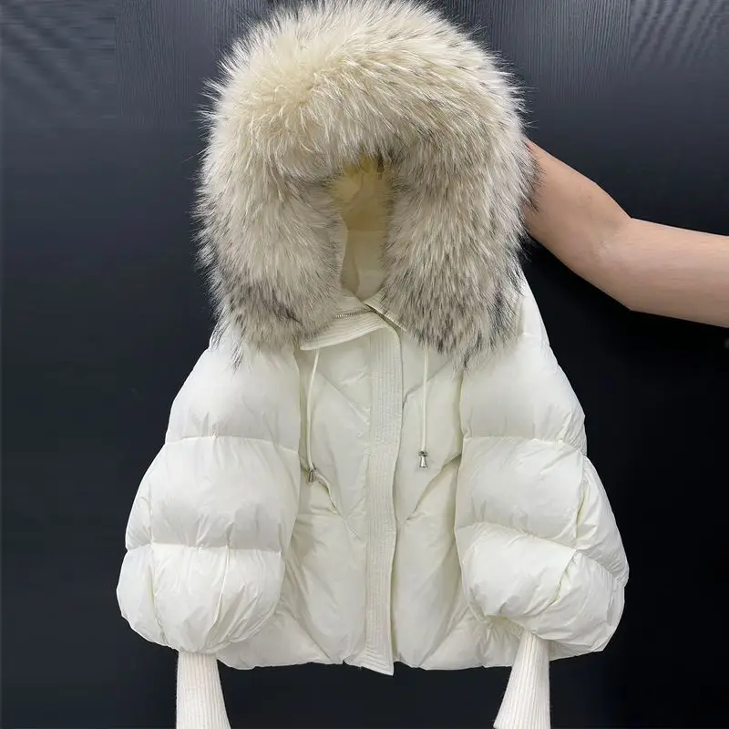 2026 秋冬新作ビッグファーカラーフード付きダウンジャケット女性のミディアムとロング厚く暖かいニットスリーブアウターウェア