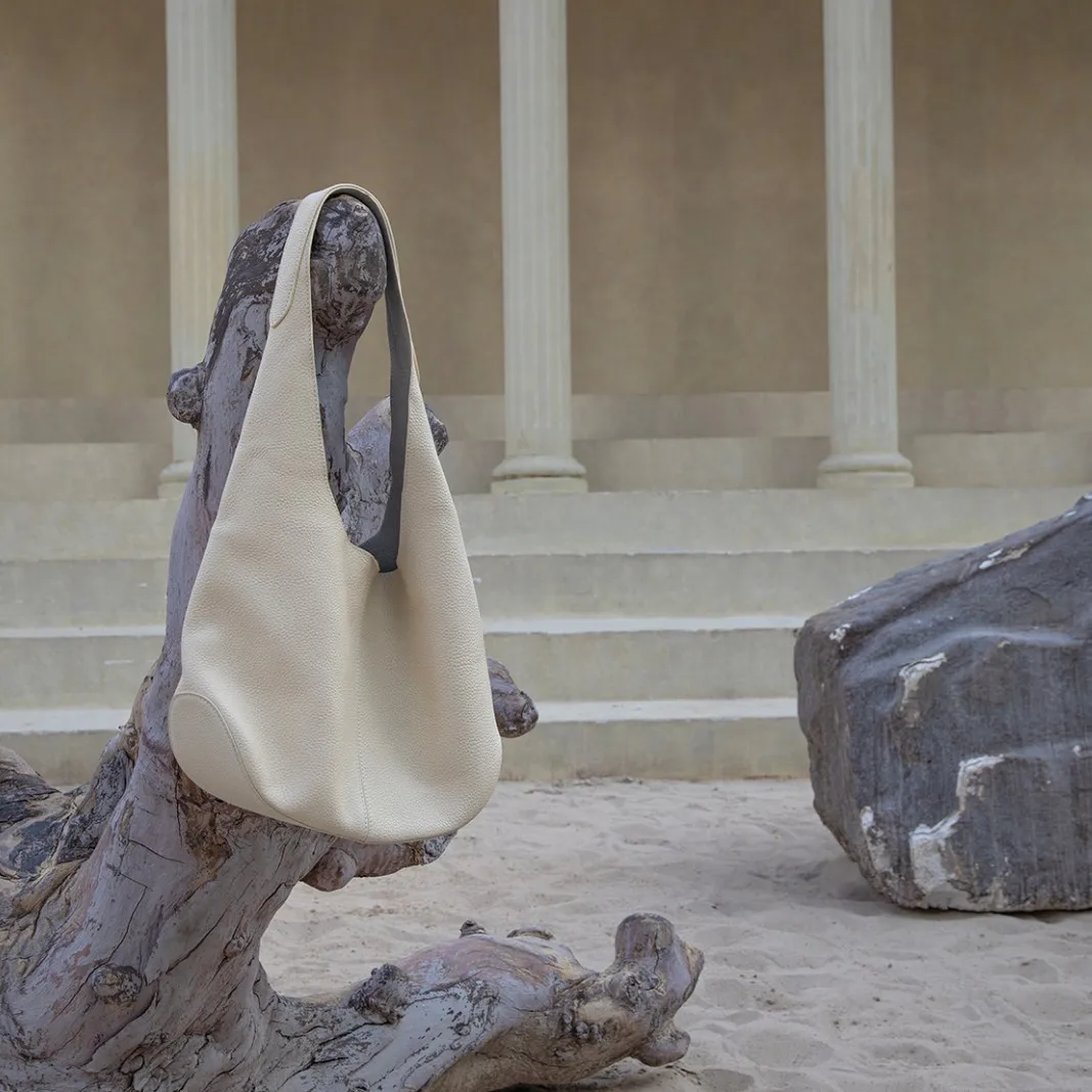 Bolso de mano informal de piel de vaca de primera capa importado de viento perezoso, bolso de cubo de moda de cuero para mujer, nuevo bolso Simple de gran capacidad