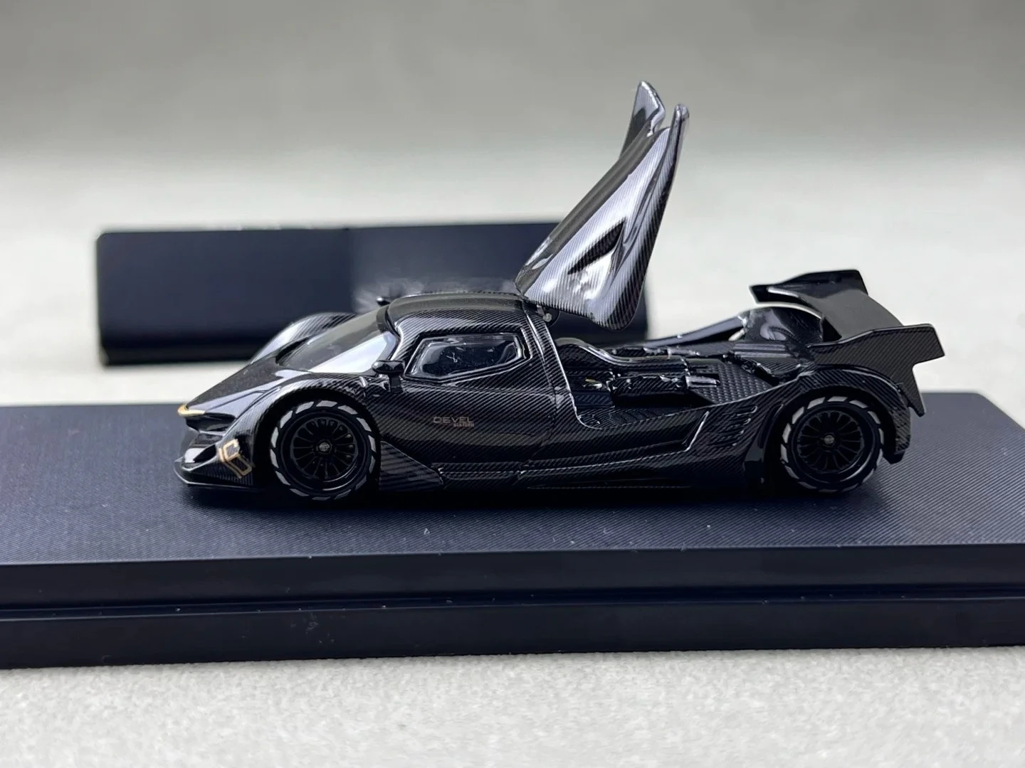 LMF 1:64 Devel 16 Black Carbon Silver/Gold Diecast Model Car