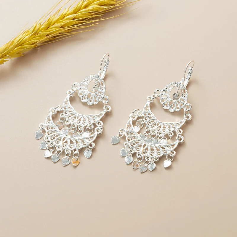 

Luxury Hollow Drop Earrings Intricate Metal Tassel Detail Ideal For Middle Eastern Bridal & Evening Gown Looks