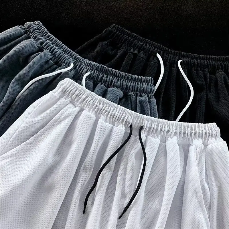 Pantalones de chándal informales Harajuku para hombre, pantalones cortos de gimnasio con costura a rayas, cordón, baloncesto, equitación, pierna ancha de cinco puntos, ropa de calle