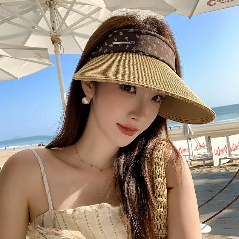 

Elegant thatched top hat with a large brim vacation style and