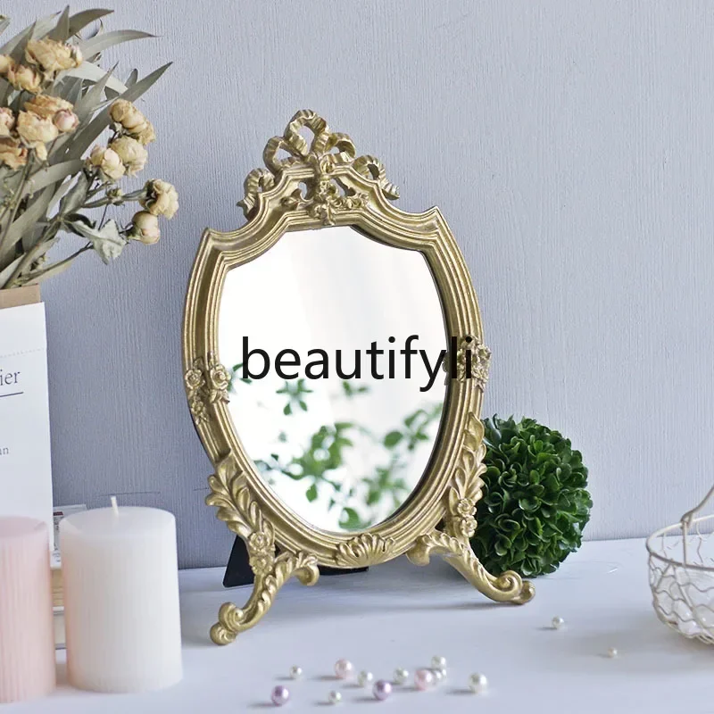 

zqq1French retro light luxury court style gold makeup dressing mirror dresser ornament