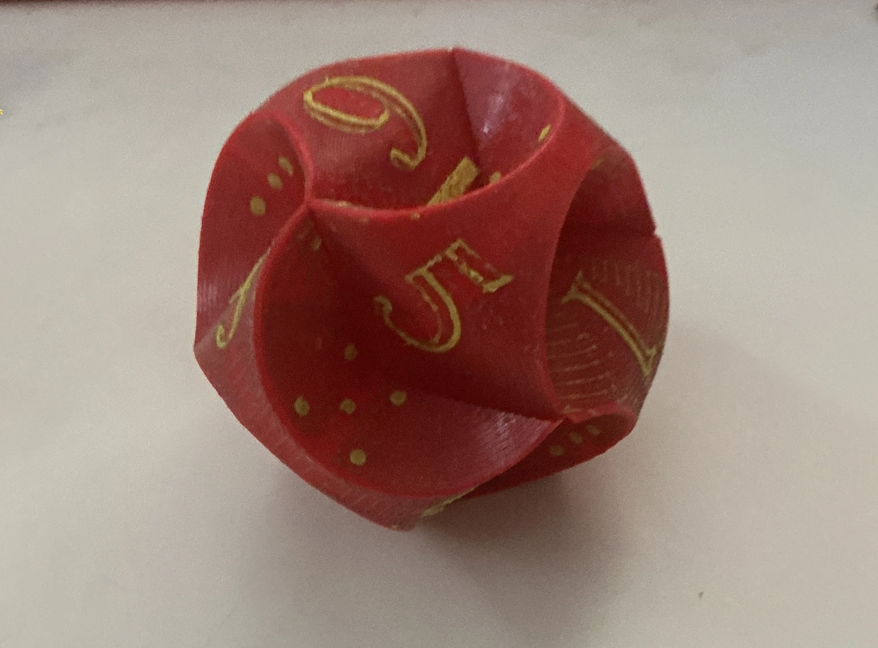 

3D Printed 12-Sided Dice - Pink Base & Yellow Numbers, Raised Dot Patterns, Subtle Black/White/Gray Watermarks | Decorative Art