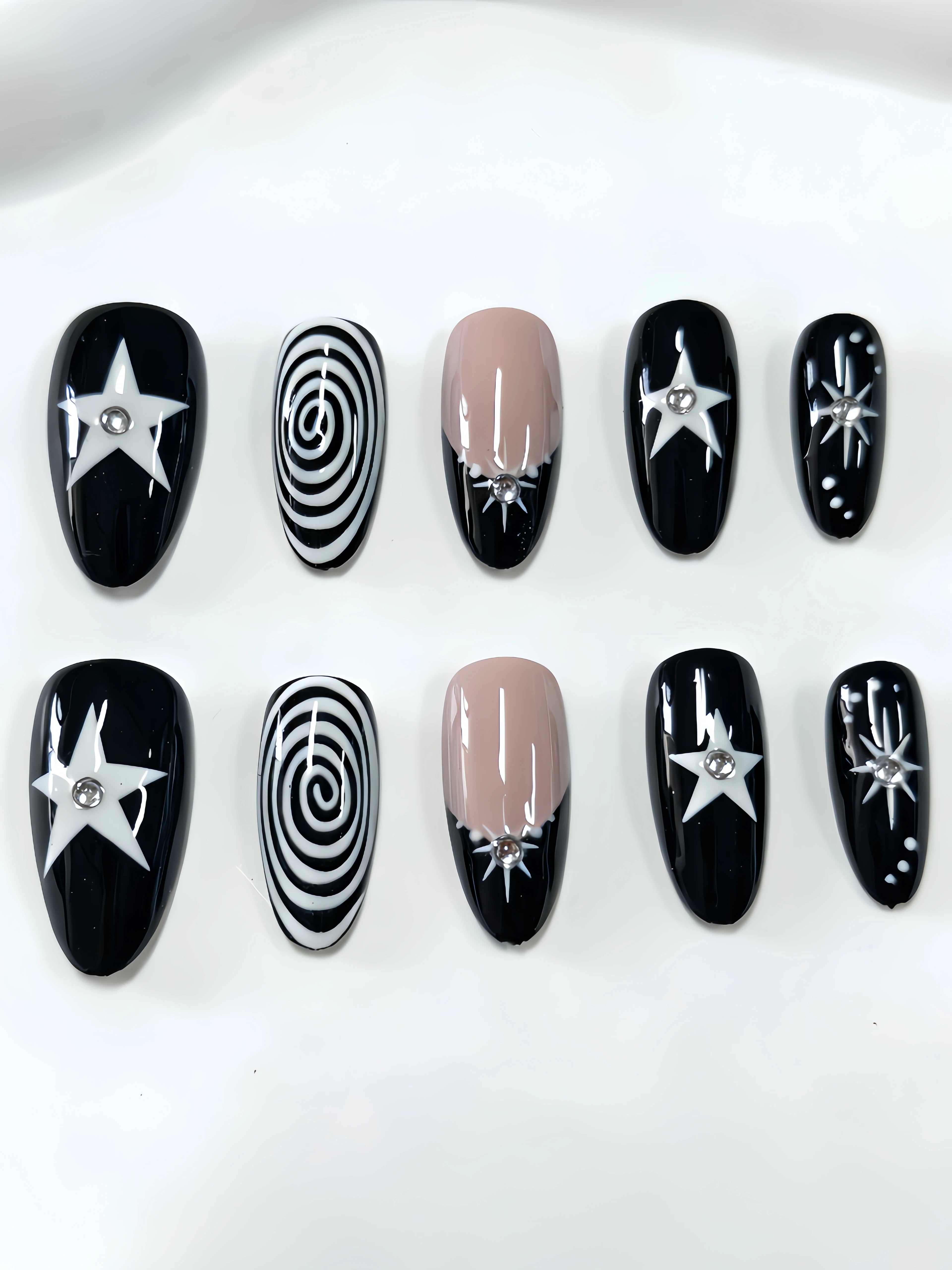 10 Medium-Length Almond-Shaped Press-On Nails, with Black and Nude Apricot as the Main Colors, Featuring Star-Shaped Rhinestones, Threaded Star Designs, French-Style Outlining, Y2K Gothic Nail Art Patches, Suitable for Office Workers, Students, Sweet and Cool Girls, and Trendy Girls' Daily Outings, Bar Nights, Music Festivals, and Vacation Seasons, Offering a Unique and Personalized Style. Includes One Jelly Glue and One Nail File