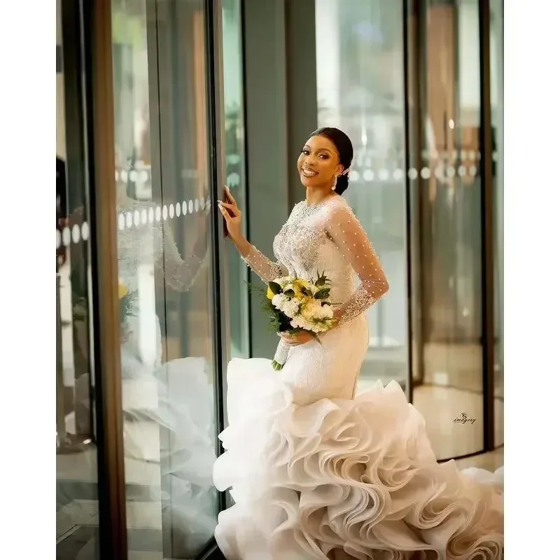 

Customized Plus Size Arabic Aso Ebi Lace Crystals Luxurious Wedding Dress Sheer Neck Pearls Beaded Tiers Long Sleeves Bridal Gow