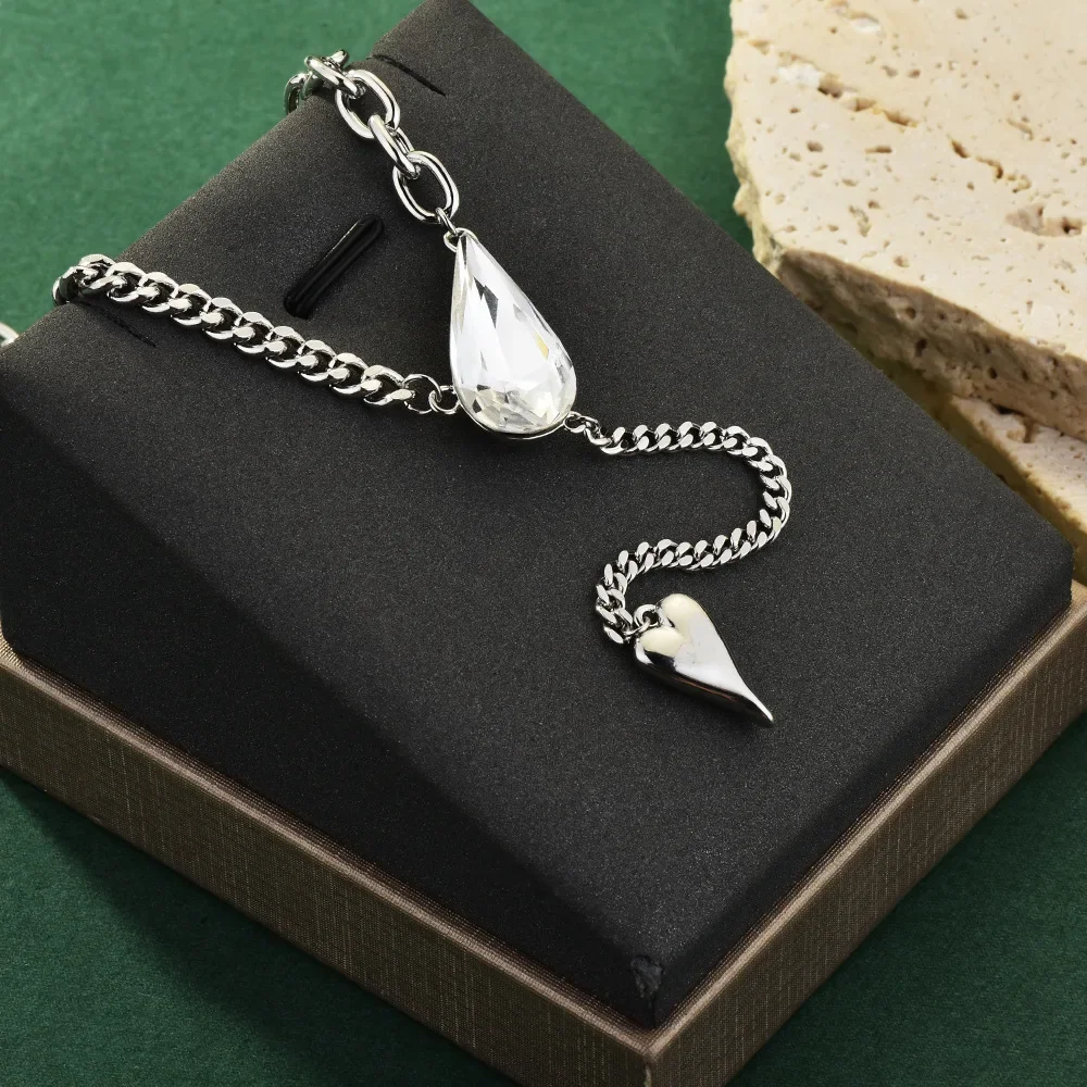 ティアドロップクリスタルネックレス、レディースファッショナブルなタッセル鎖骨チェーン、チェーンスプライシング、セーターチェーン