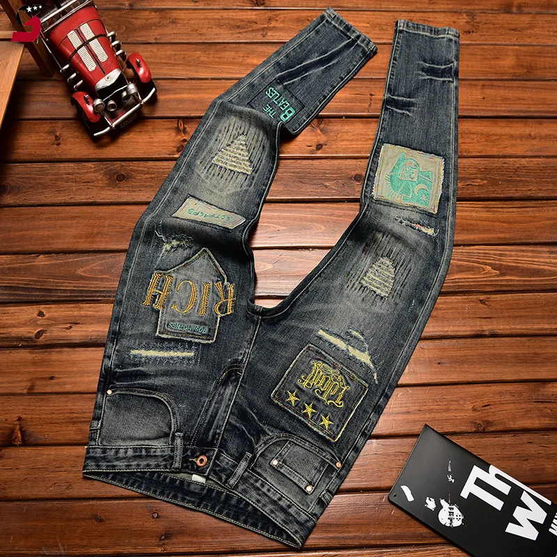 Pantalones vaqueros americanos de marcas de moda para hombres, pantalones largos ajustados elásticos azules con agujero y parche de pasta, bordado de tela Pu Shuai