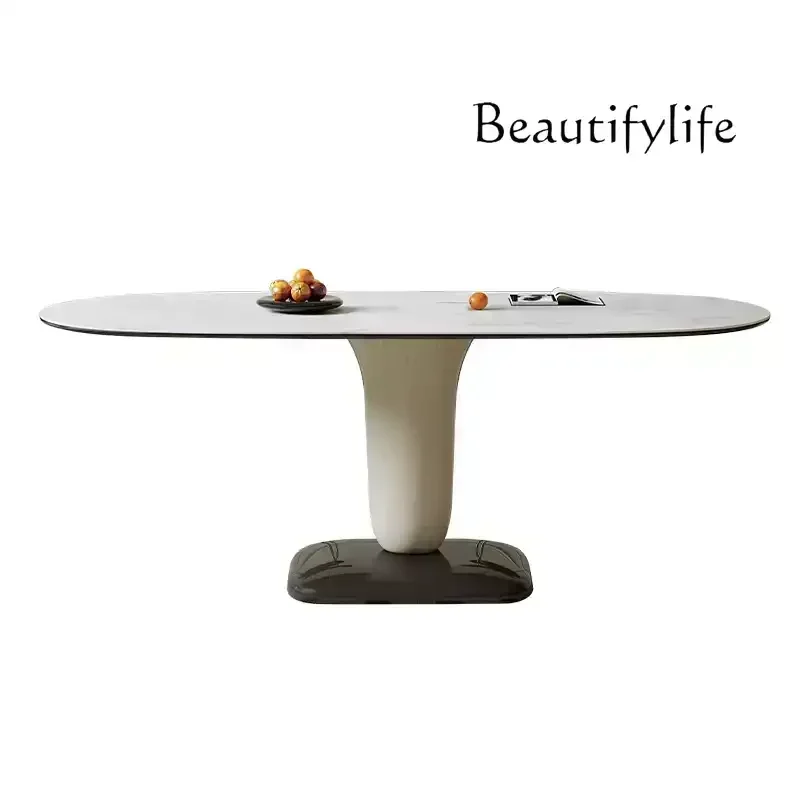 

Cream wind rock slab dining table and chair combination modern simple household French high-end oval dining table