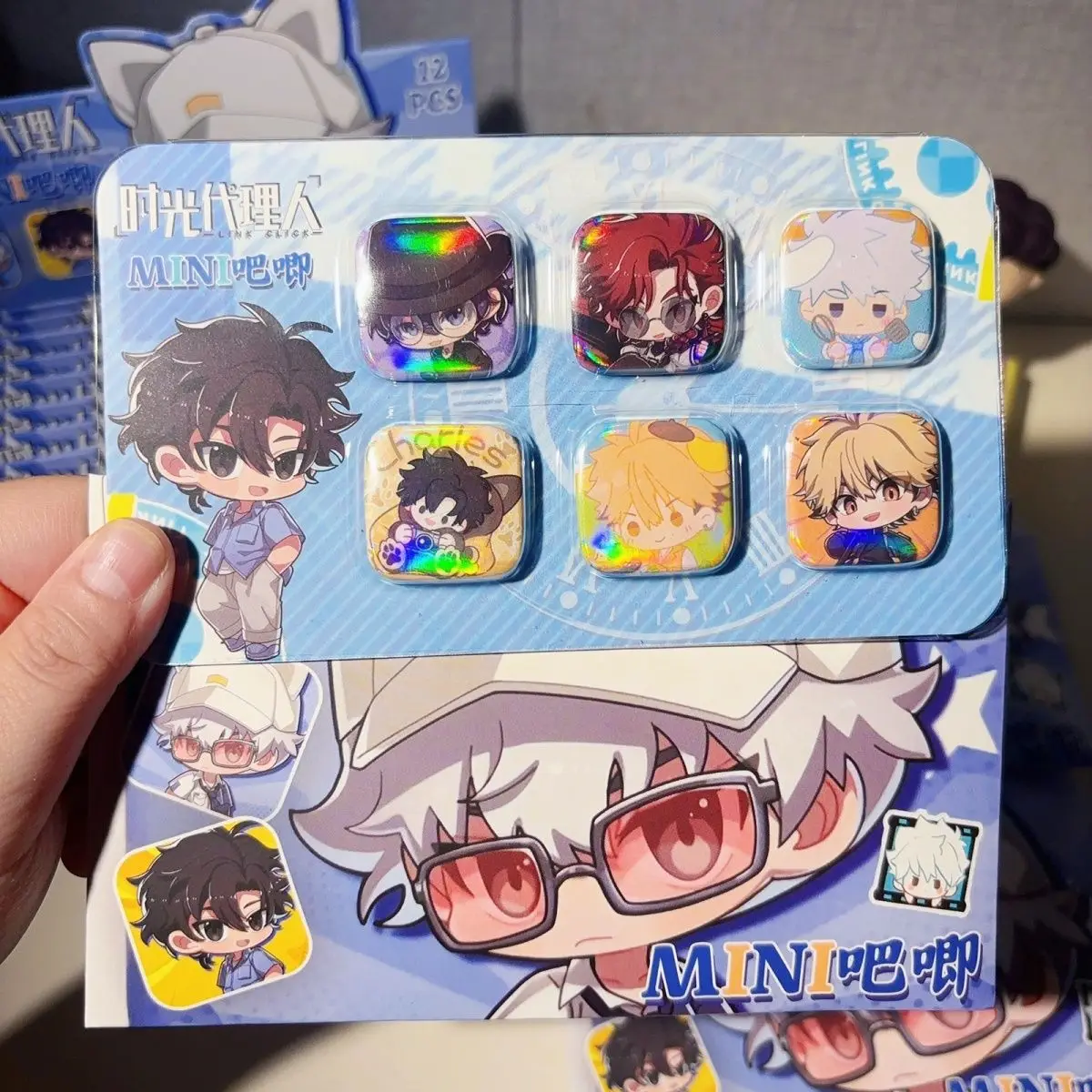 Time Agent Mini Square Kiss Collectible Box - One pack contains 6 randomly selected cartoon-shaped tin badges. view 3