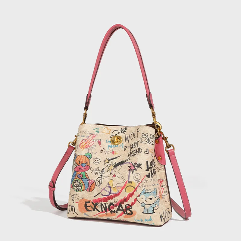 

Элитная сумка-ведро с граффити в стиле колор-блок, новинка 2026 года, женская нишевая сумка с принтом, универсальная маленькая сумочка на плечо/через плечо для повседневного использования