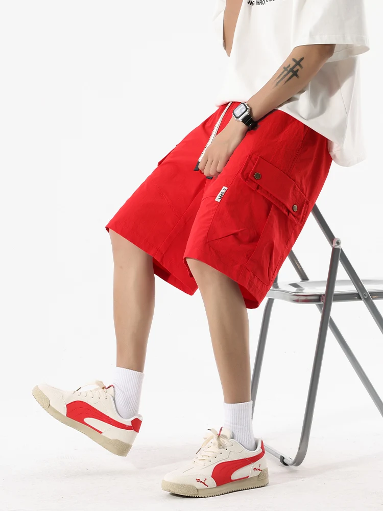 Short de travail multi-poches pour hommes, grande taille, soie glacée, séchage rapide, taille élastique, cordon de serrage, design tendance, cinq pantalons, nouvelle collection été
