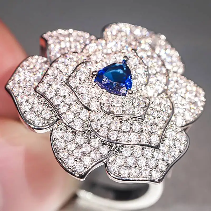 Huitan Damenring mit Vollbesatz aus Zirkonia, Blaue Blumenform, für Hochzeit und Party, Frischer Stil, Jubiläum, Trendiges Accessoire, Luxuriöses Schmuckgeschenk