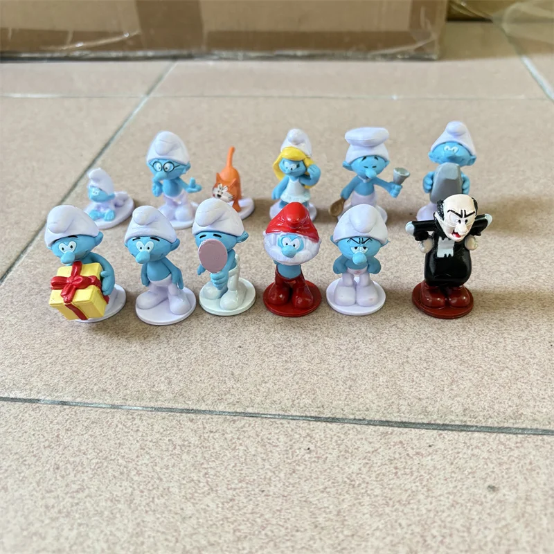 Venta caliente 12 Uds Anime dibujos animados Smurfs figura PVC modelo juguetes lindo espíritu azul muñeca pastel decoración Kawaii elfo bebé pastel forma regalos
