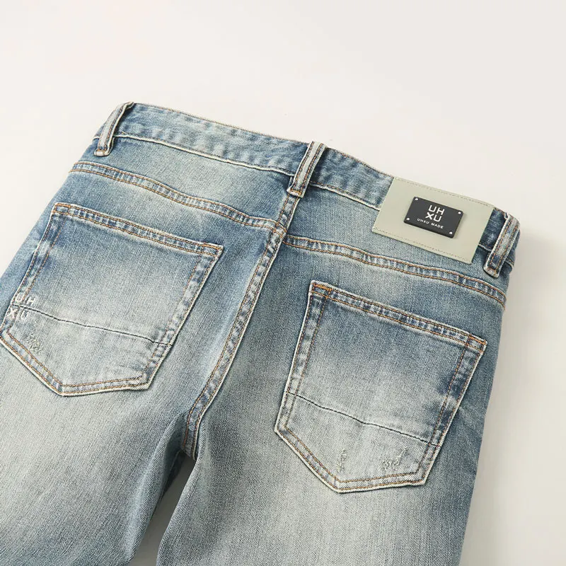 Fashionadesigner mode nieuwe herenjeans met kras, rimpel, borduurwerk, nostalgische stretch, slim fit, retro gewassen, lichtblauw