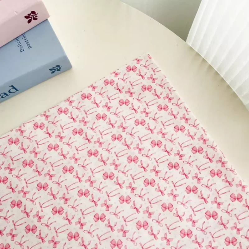 

Pink bow pattern fabric, used for handmade production of children's clothing, women's clothing, bags, headbands, and other fabri