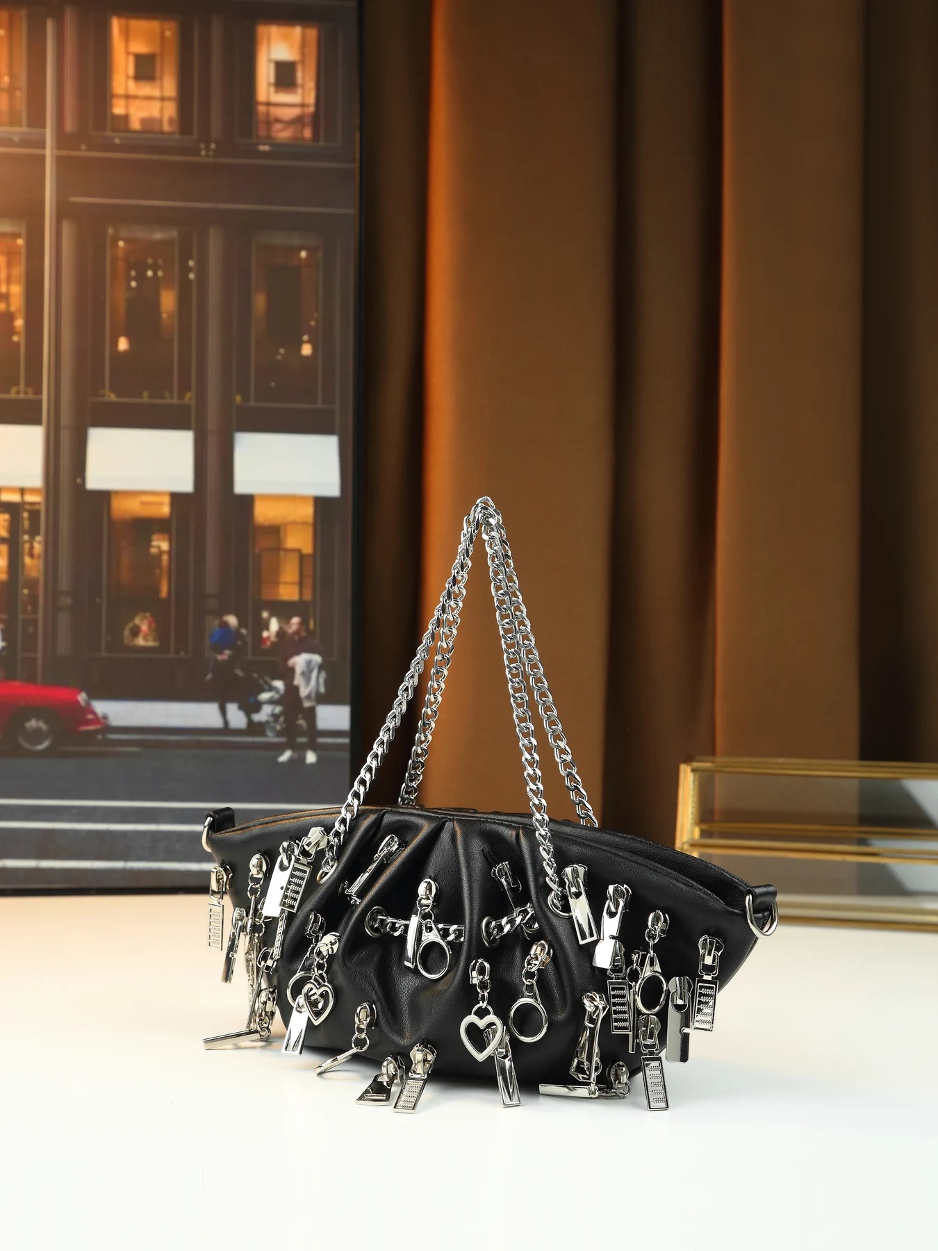 

Edgy punk pleated cloud bag featuring zipper and chain tote for stylish babes