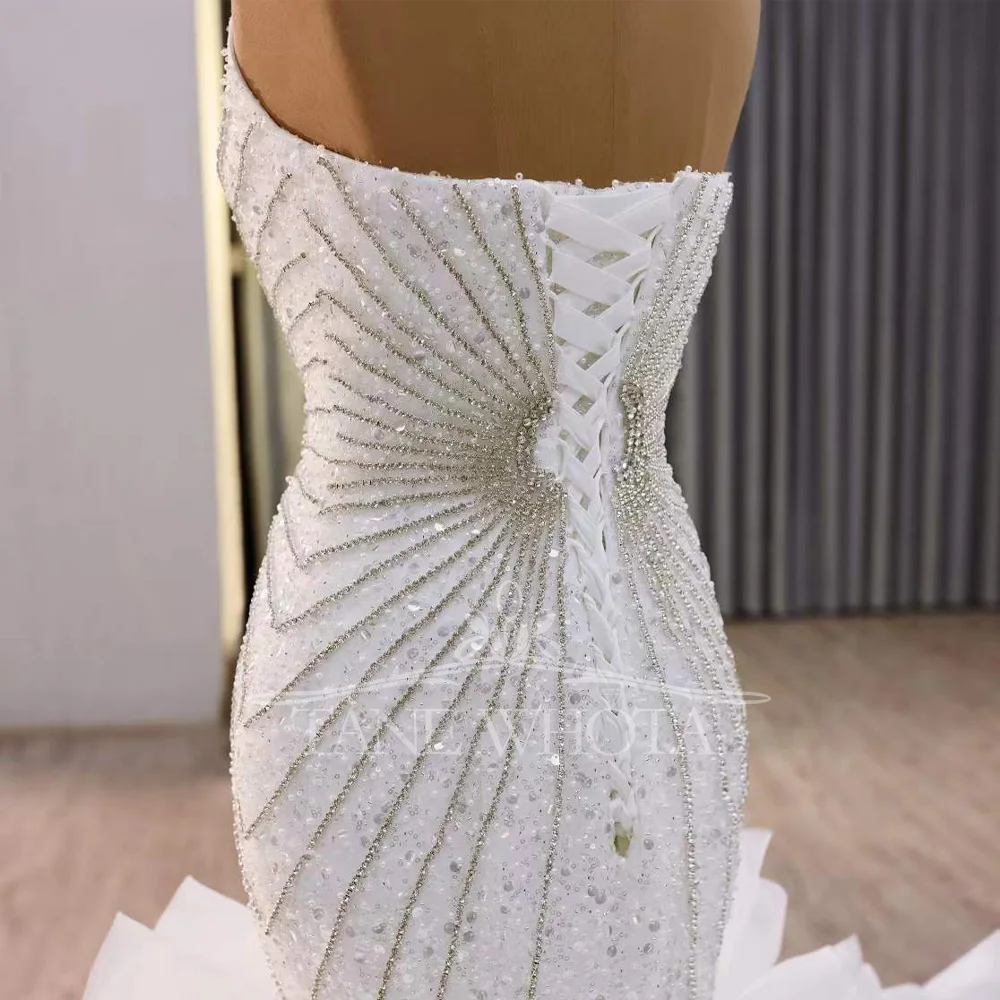 ชุดแต่งงานแบบไม่มีแขน ดีไซน์เซ็กซี่หวานซึ้ง ประดับด้วยลูกปัดและเลื่อม แต่งเชือกผูกด้านหลัง ทรงเข้ารูป สามารถสั่งตัดได้ สวยสง่างาม ทันสมัย