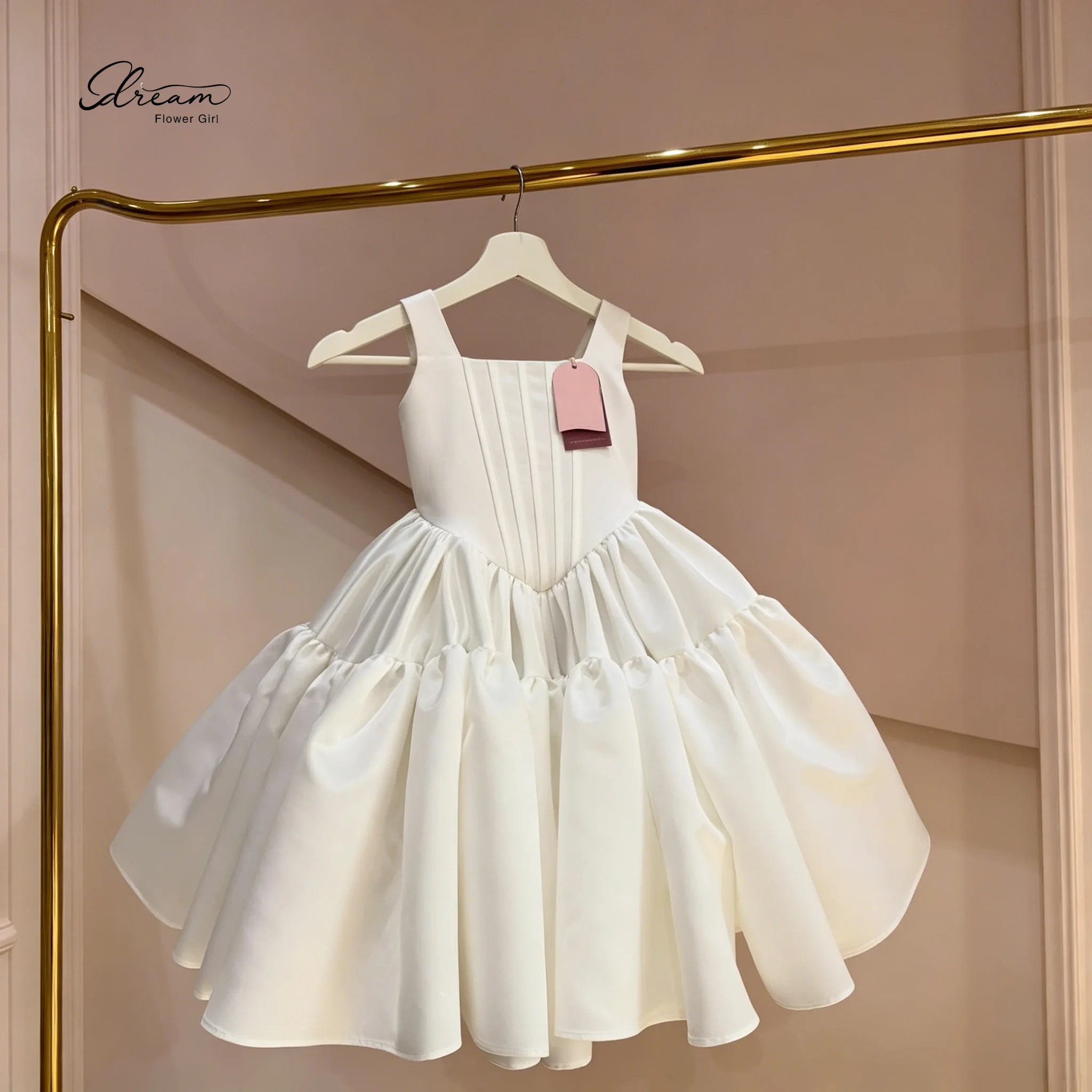 SweetDream Flower Girl Store White satin sleeveless tulle dress for children, with delicate tie-up design.